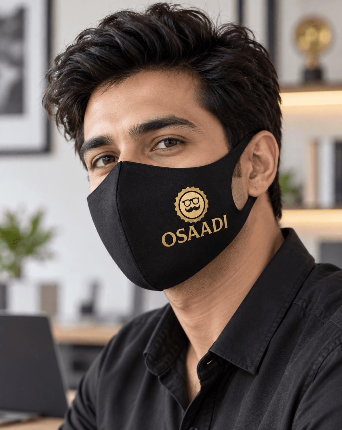 Person wearing a personalised black face mask in an everyday setting.